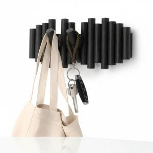 Magán: Wall-mounted coat rack with retractable pegs Retractable